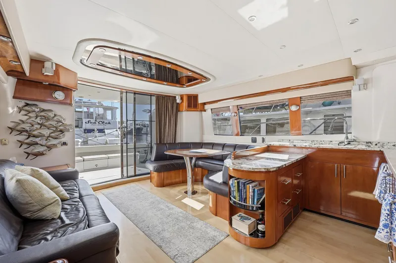 Slide: The Image of Luxurious interior of a 2006 Carver 56 Voyager yacht with modern furnishings and elegant design. - 21