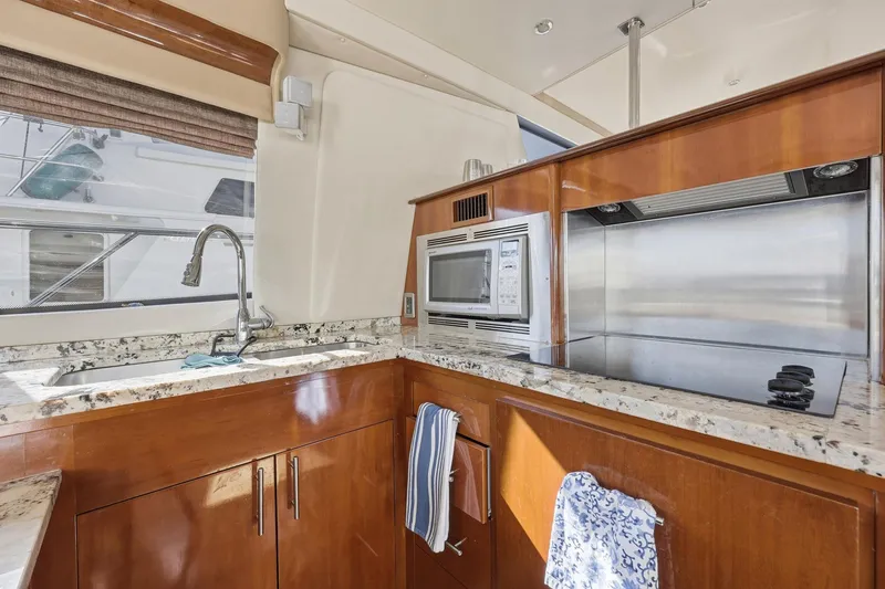 Slide: The Image of Luxurious kitchen in a 2006 Carver 56 Voyager yacht with modern appliances. - 24