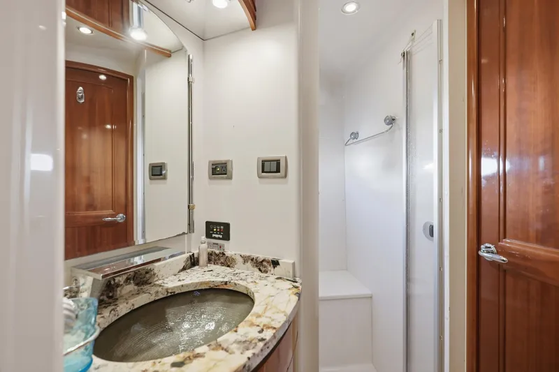 Slide: The Image of Luxurious bathroom in 2006 Carver 56 Voyager yacht with marble sink and shower. - 33