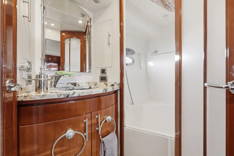 Slide: The Image of Luxurious bathroom interior of 2006 Carver 56 Voyager yacht with elegant wood finishes. - 40