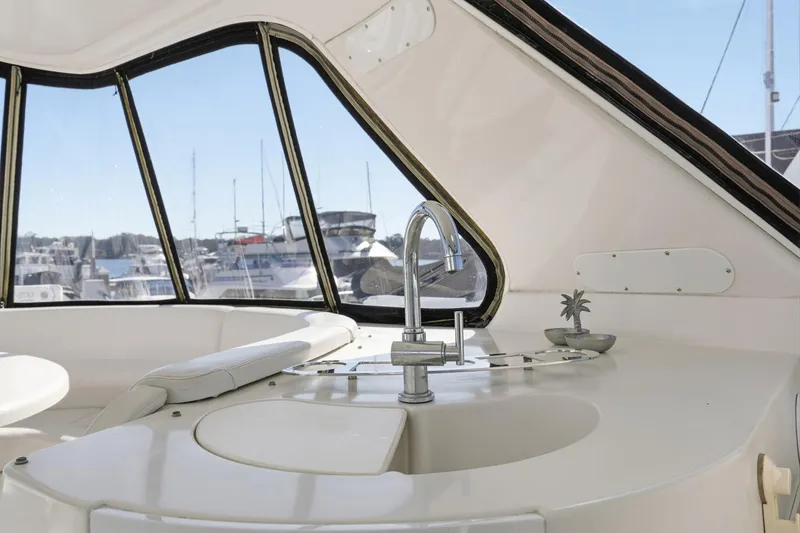 Slide: The Image of Interior of 2006 Carver 56 Voyager yacht with sink and marina view. - 47