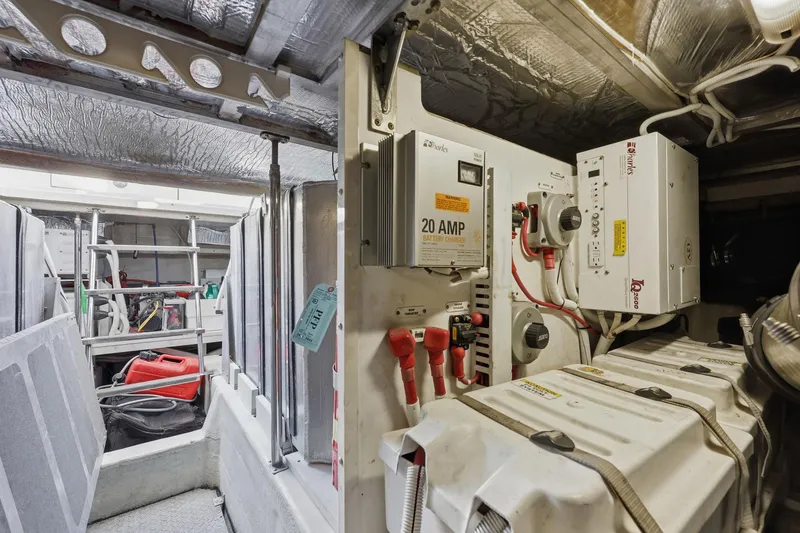 Slide: The Image of Engine room of 2006 Carver 56 Voyager with battery charger and equipment. - 58
