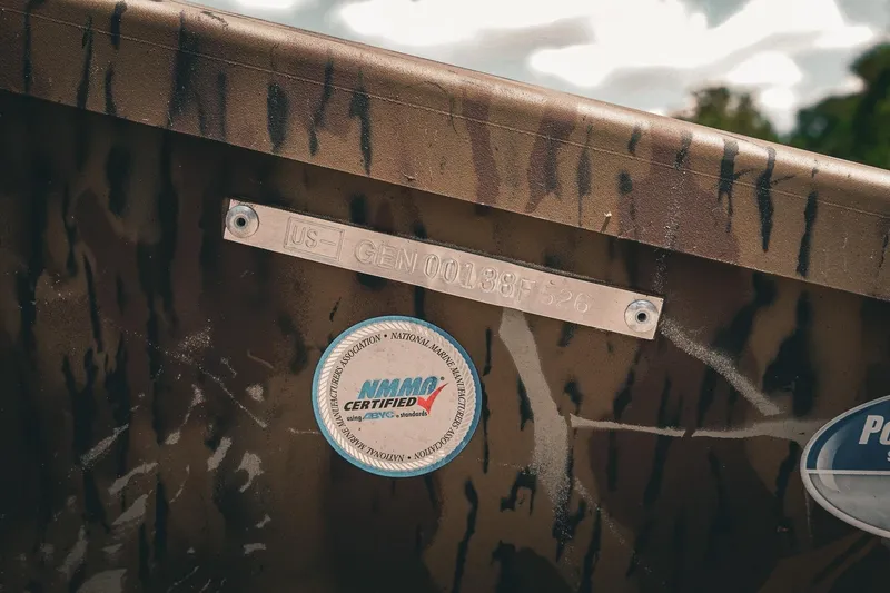 Slide: The Image of 2026 G3 Gator Tough 18 CCJ boat with NMMA certification label and identification plate. - 11