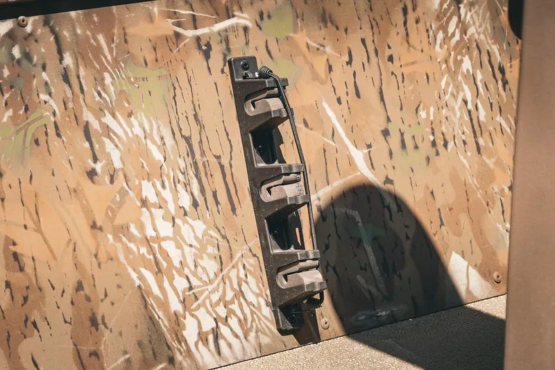 Slide: The Image of 2026 G3 Gator Tough 18 CCJ boat with camo pattern and mounted accessory holder. - 12