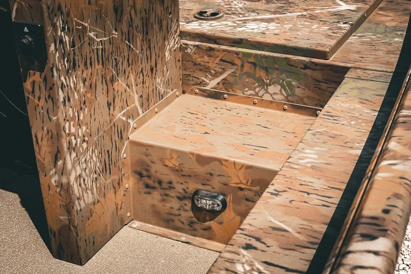 Slide: The Image of 2026 G3 Gator Tough 18 CCJ boat interior with camouflage design. - 15