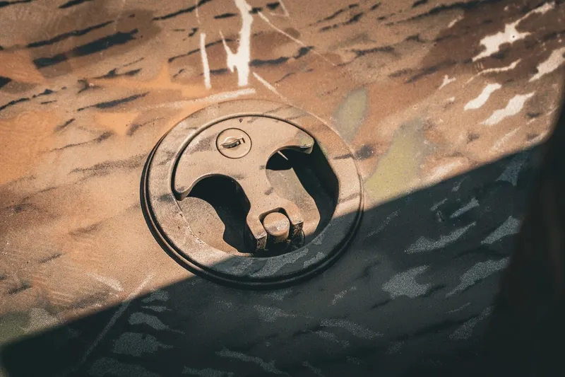 Slide: The Image of Fuel cap on 2026 G3 Gator Tough 18 CCJ boat with camouflage pattern. - 20