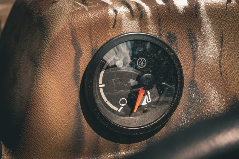 Slide: The Image of Close-up of a fuel gauge on a 2026 G3 Gator Tough 18 CCJ boat. - 21