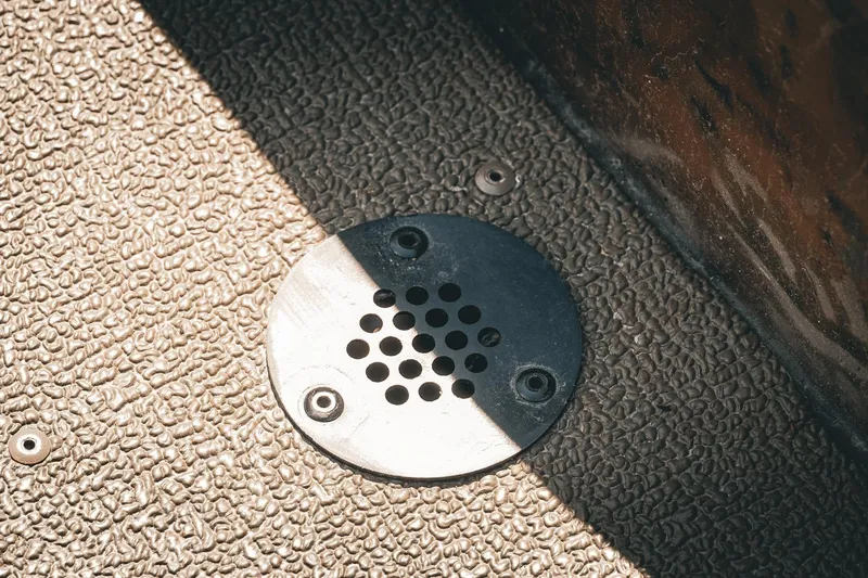 Slide: The Image of Floor drain on 2026 G3 Gator Tough 18 CCJ boat with textured surface. - 24