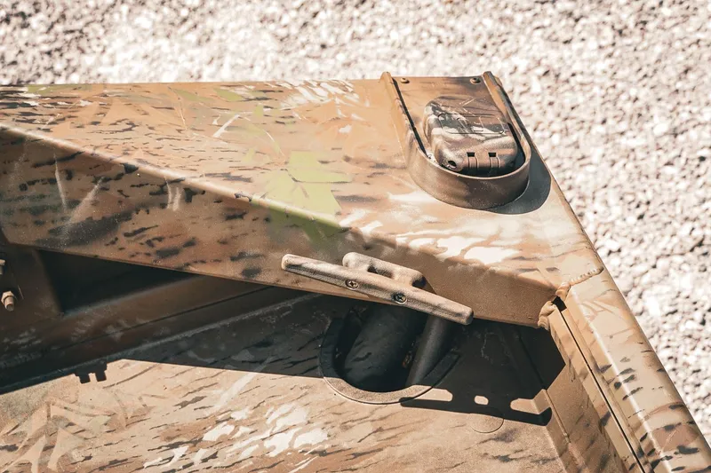 Slide: The Image of 2026 G3 Gator Tough 18 CCJ boat with camouflage design and cleat detail. - 25