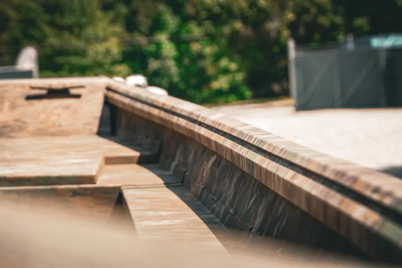 Slide: The Image of 2026 G3 Gator Tough 18 CCJ boat, close-up of deck and railing, outdoors. - 26