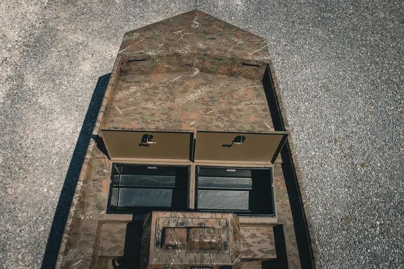 Slide: The Image of 2026 G3 Gator Tough 18 CCJ boat with camo design and storage compartments. - 34