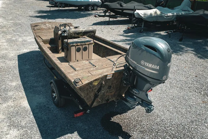 Slide: The Image of 2026 G3 Gator Tough 18 CCJ boat with Yamaha outboard motor on gravel. - 5