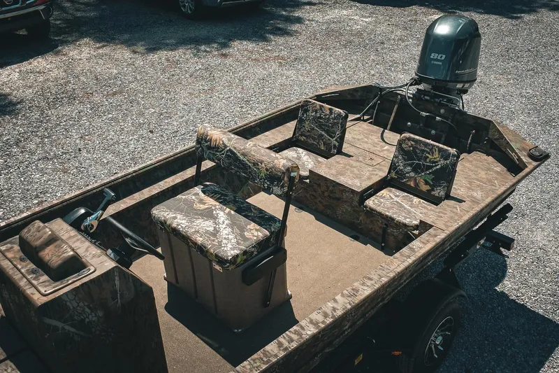 Slide: The Image of 2026 G3 Gator Tough 18 CCJ boat with camo seats and Yamaha outboard motor. - 6