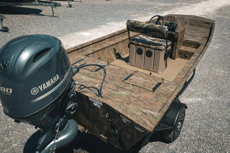 Slide: The Image of 2026 G3 Gator Tough 18 CCJ boat with Yamaha motor, camo design, and trailer. - 7