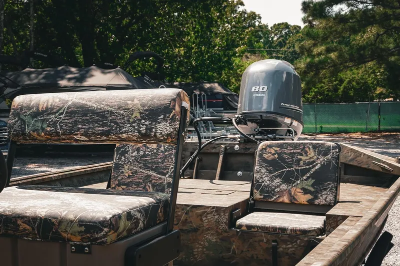 Slide: The Image of 2026 G3 Gator Tough 18 CCJ boat with camo seats and Yamaha motor. - 8
