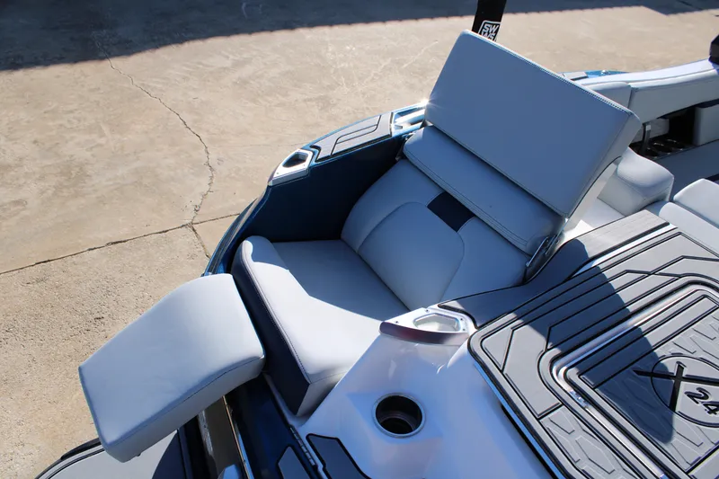 Slide: The Image of 2022 MasterCraft X24 boat interior with luxurious seating and modern design. - 10
