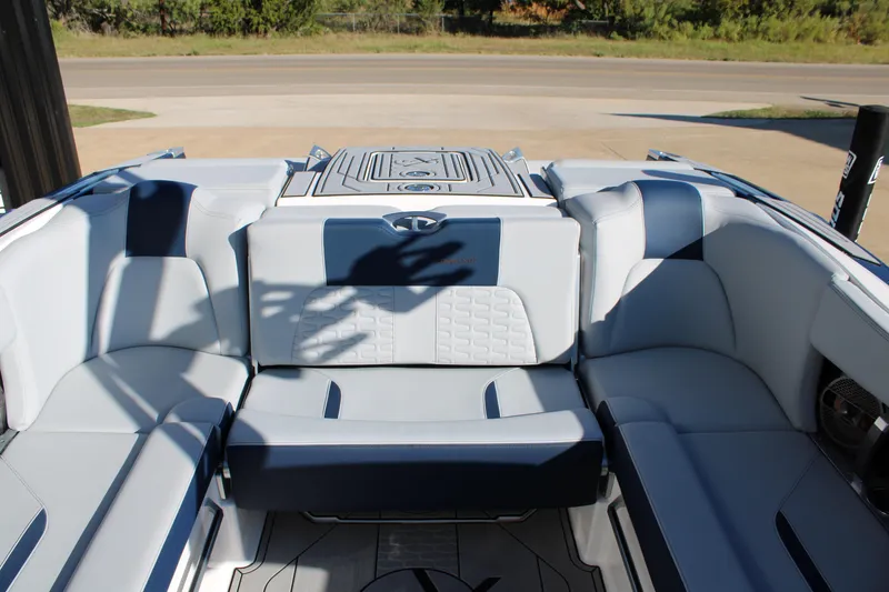 Slide: The Image of 2022 MasterCraft X24 boat interior with luxurious seating and modern design. - 12