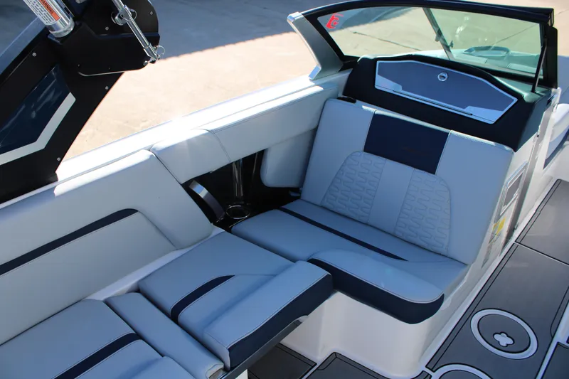 Slide: The Image of 2022 MasterCraft X24 boat interior with sleek seating and modern design. - 16