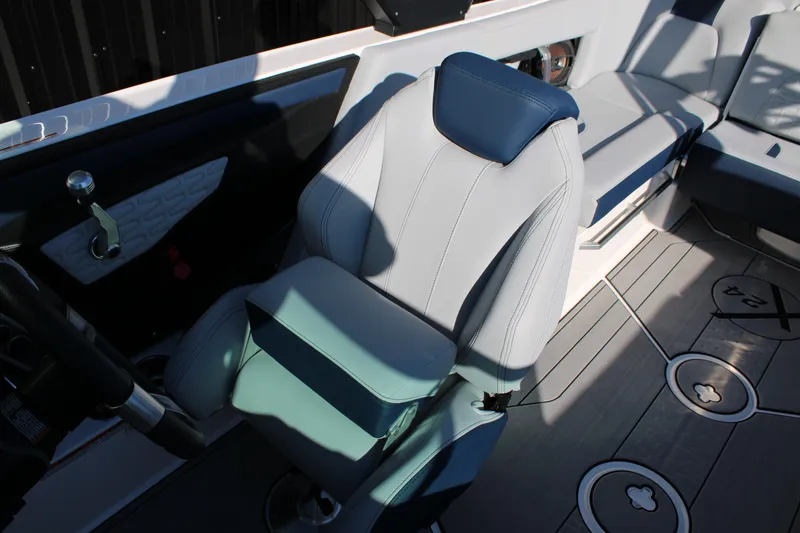 Slide: The Image of 2022 MasterCraft X24 boat interior with luxury seating and modern design. - 19