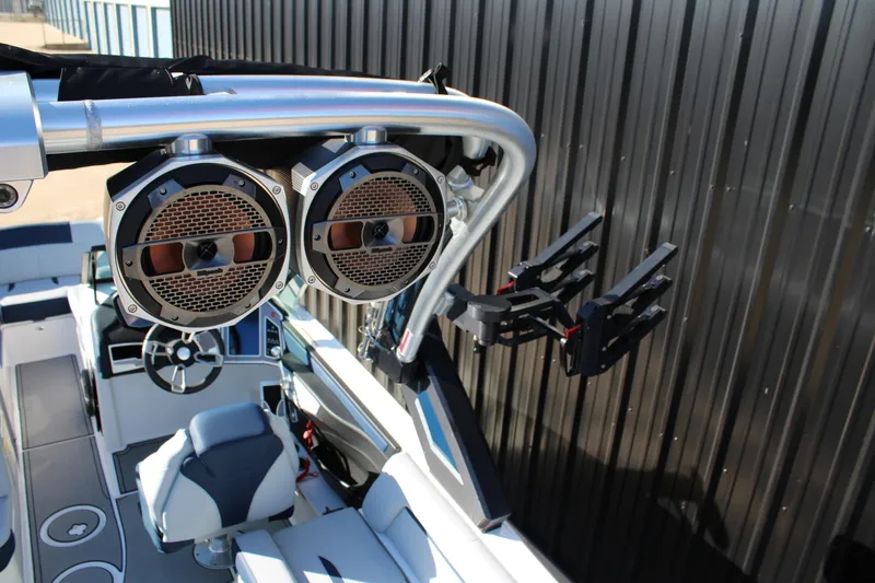 Slide: The Image of 2022 MasterCraft X24 boat interior with speakers and wakeboard rack. - 21