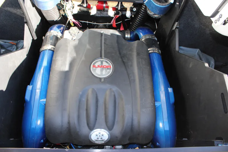 Slide: The Image of 2022 MasterCraft X24 engine compartment with Ilmor engine, featuring blue components. - 22