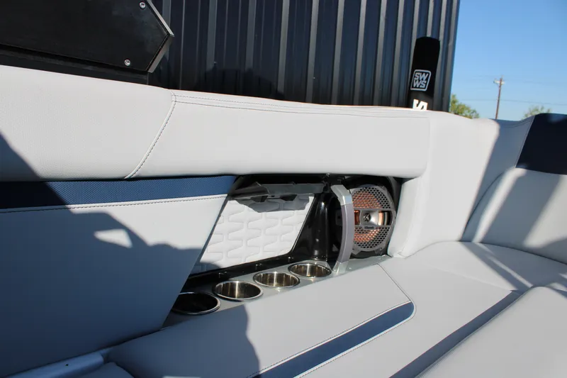 Slide: The Image of 2022 MasterCraft X24 interior with speaker and cup holders, featuring sleek design elements. - 23