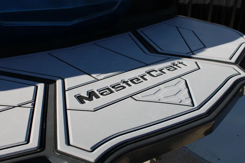 Slide: The Image of 2022 MasterCraft X24 boat platform with embossed logo design. - 26