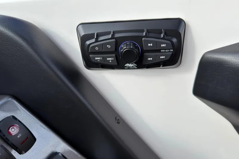 Slide: The Image of Control panel of 2025 Supreme S220 boat with audio system buttons. - 18