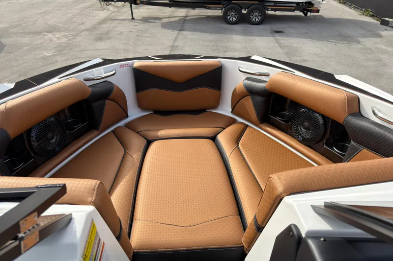 Slide: The Image of Luxurious interior of 2025 Supreme S220 boat with tan and black seating. - 23