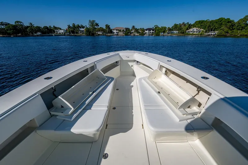 Slide: The Image of 2017 SeaVee 390Z boat interior with open seating, on calm water, under clear blue sky. - 11