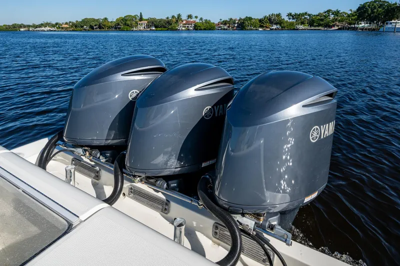 Slide: The Image of 2017 SeaVee 390Z boat with triple Yamaha outboard engines on a calm lake. - 22
