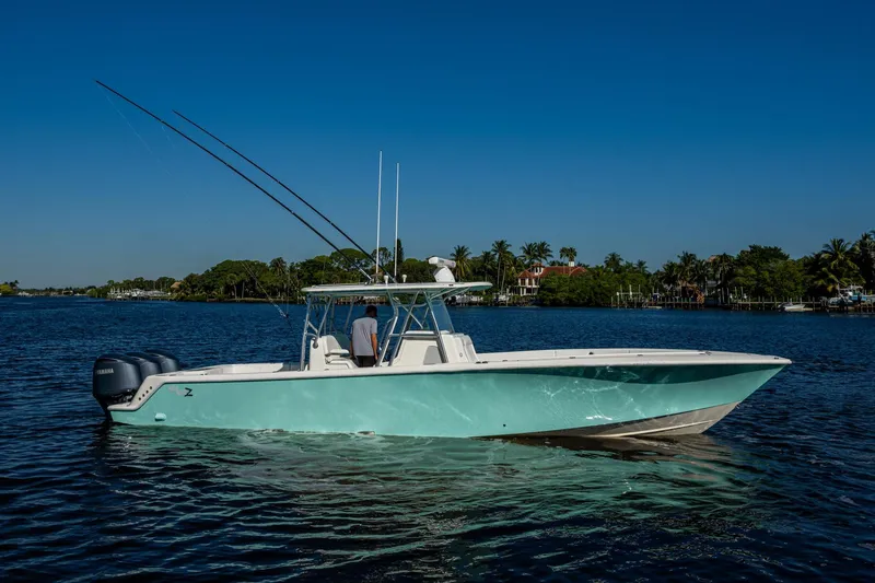 Slide: The Image of 2017 SeaVee 390Z boat on calm water under clear blue sky. - 24