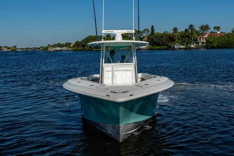 Slide: The Image of 2017 SeaVee 390Z boat cruising on a calm blue waterway. - 4