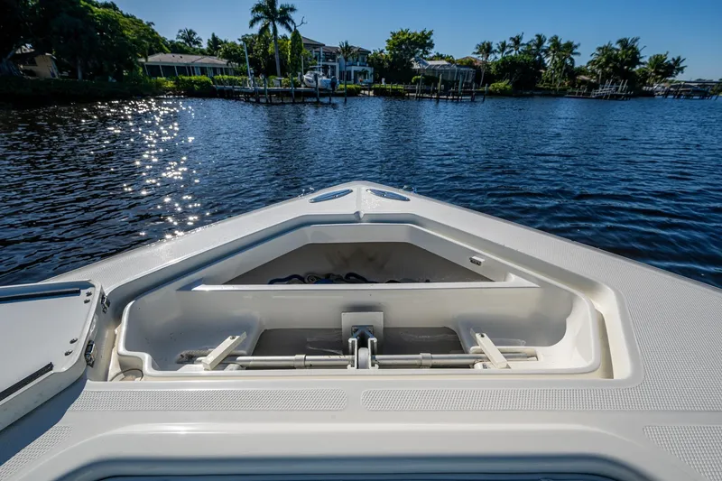 Slide: The Image of Bow view of 2017 SeaVee 390Z boat on a sunny day, near a waterfront. - 7