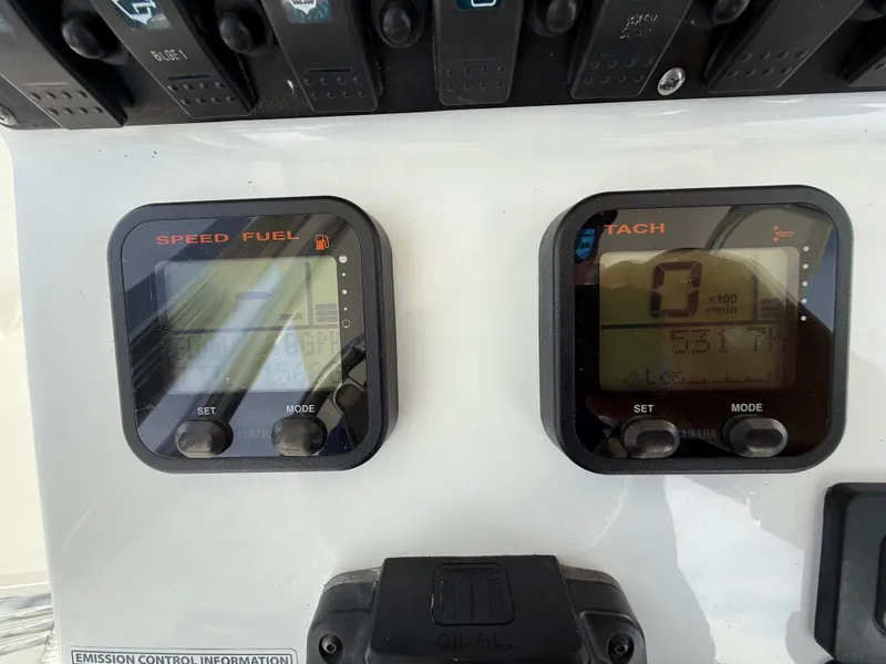 Slide: The Image of Close-up of 2012 Sea Hunt Triton 240 boat dashboard gauges. - 14