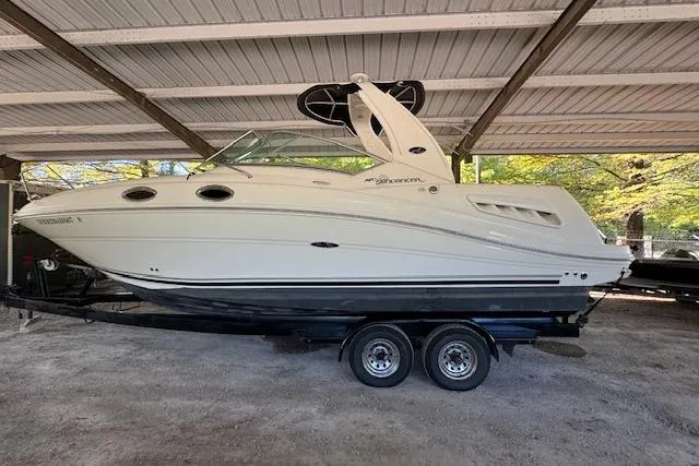 The Image of 2007 Sea Ray 260 Sundancer boat on trailer under shelter. - 0