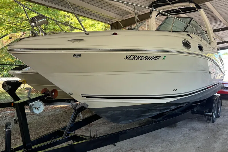 Slide: The Image of 2007 Sea Ray 260 Sundancer boat on trailer under shelter. - 1