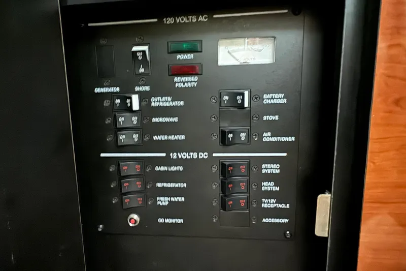 Slide: The Image of Electrical control panel of a 2007 Sea Ray 260 Sundancer boat. - 25