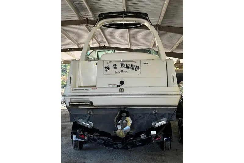 Slide: The Image of 2007 Sea Ray 260 Sundancer boat, rear view, under covered storage. - 3