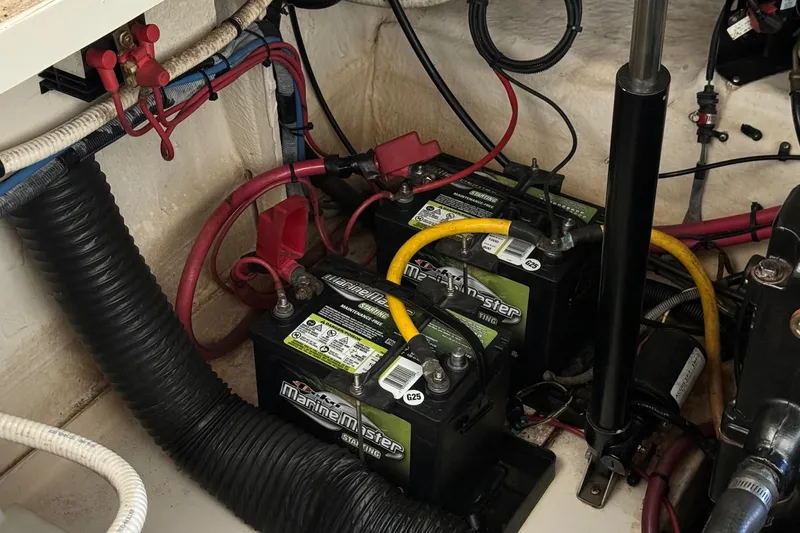 Slide: The Image of Engine compartment of 2007 Sea Ray 260 Sundancer with Marine Master batteries and wiring. - 30