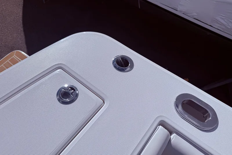 Slide: The Image of 2026 Regulator 28 boat deck with textured surface and metal fittings. - 16