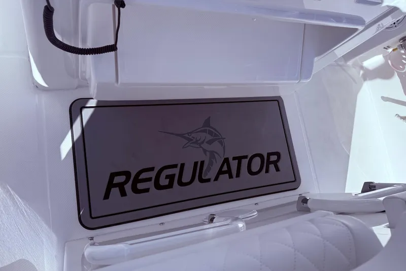 Slide: The Image of 2026 Regulator 28 boat interior with logo mat and seating. - 19