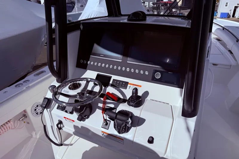 Slide: The Image of 2026 Regulator 28 boat helm with modern controls and navigation display. - 20