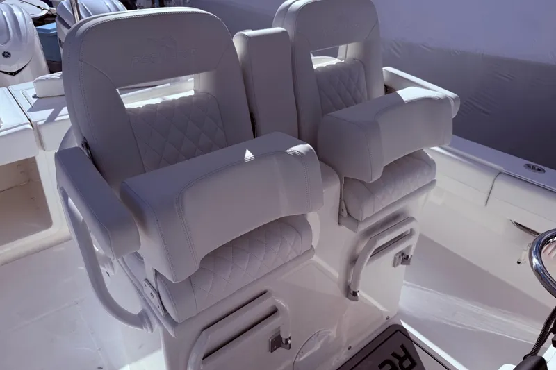 Slide: The Image of 2026 Regulator 28 boat seats with quilted design and armrests. - 22