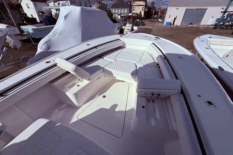 Slide: The Image of 2026 Regulator 28 boat interior with cushioned seating and storage compartments. - 38