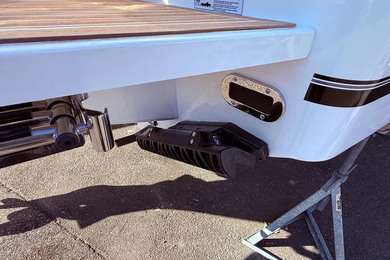 Slide: The Image of 2026 Regulator 28 boat stern detail with trim tab and exhaust port. - 7