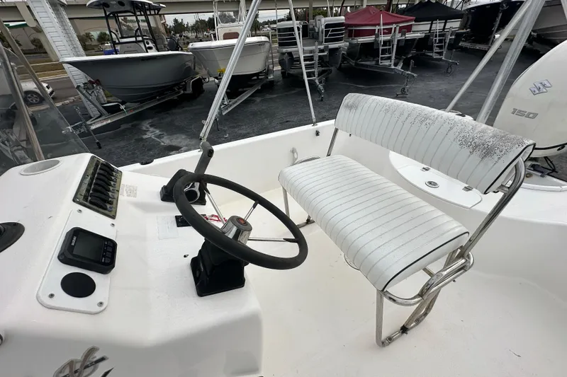 Slide: The Image of 2001 Century 2101 Bay Boat interior with steering wheel and seating. - 17