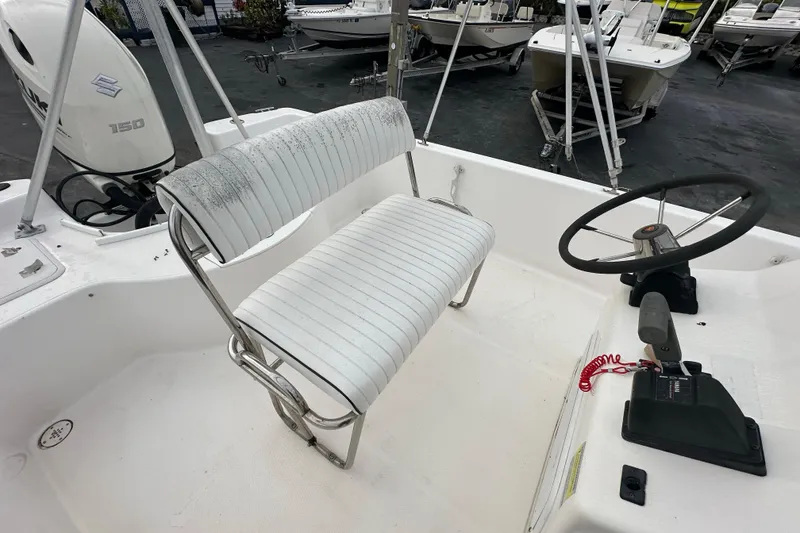 Slide: The Image of 2001 Century 2101 Bay Boat interior with steering wheel and seating. - 19