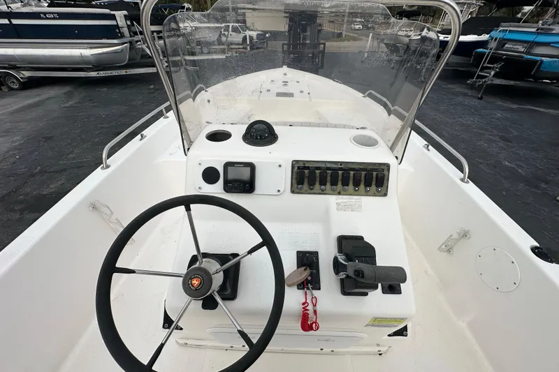 Slide: The Image of Century 2101 Bay Boat 2001 dashboard with steering wheel and control panel. - 21