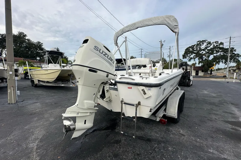 Slide: The Image of 2001 Century 2101 Bay Boat with Suzuki outboard motor on trailer. - 5